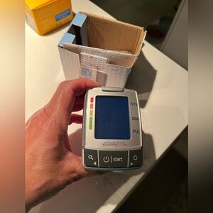 Accura pulse wrist blood pressure monitor. In box.  In working order.
